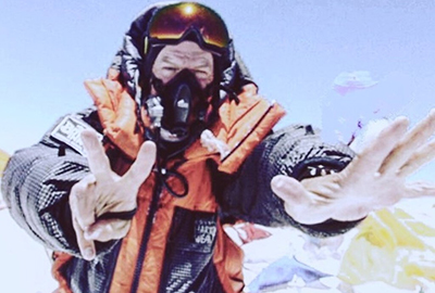 Mark Pattison at the summit of Mt. Everest