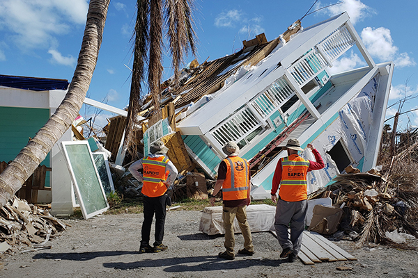 Following Hurricane Dorian, RAPID Operations Engineer Andrew Lyda (right) and researchers from Auburn University survey damage to structures located on the Abaco Islands in the Bahamas.