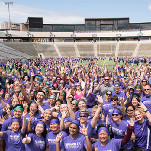 crowd of people wearing purple t-shirts in Husky Stadium