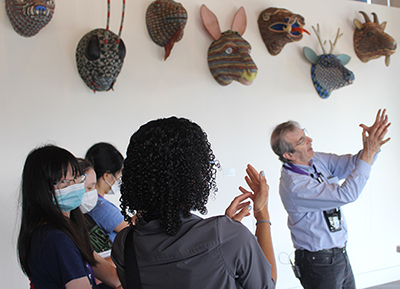 Eric Chudler demonstrating how to create a string neuron.