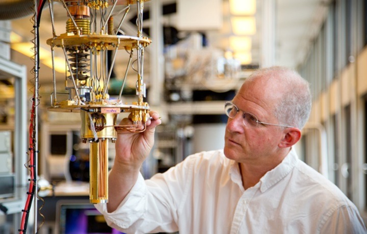 Professor Charles Marcus makes adjustments on equipment in his lab at the Niels Bohr Institute in Copenhagen, Denmark