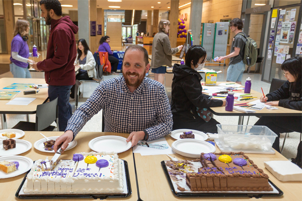 man at the table serving cake