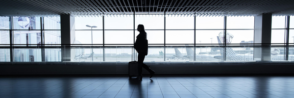 Person walking in an airport terminal.