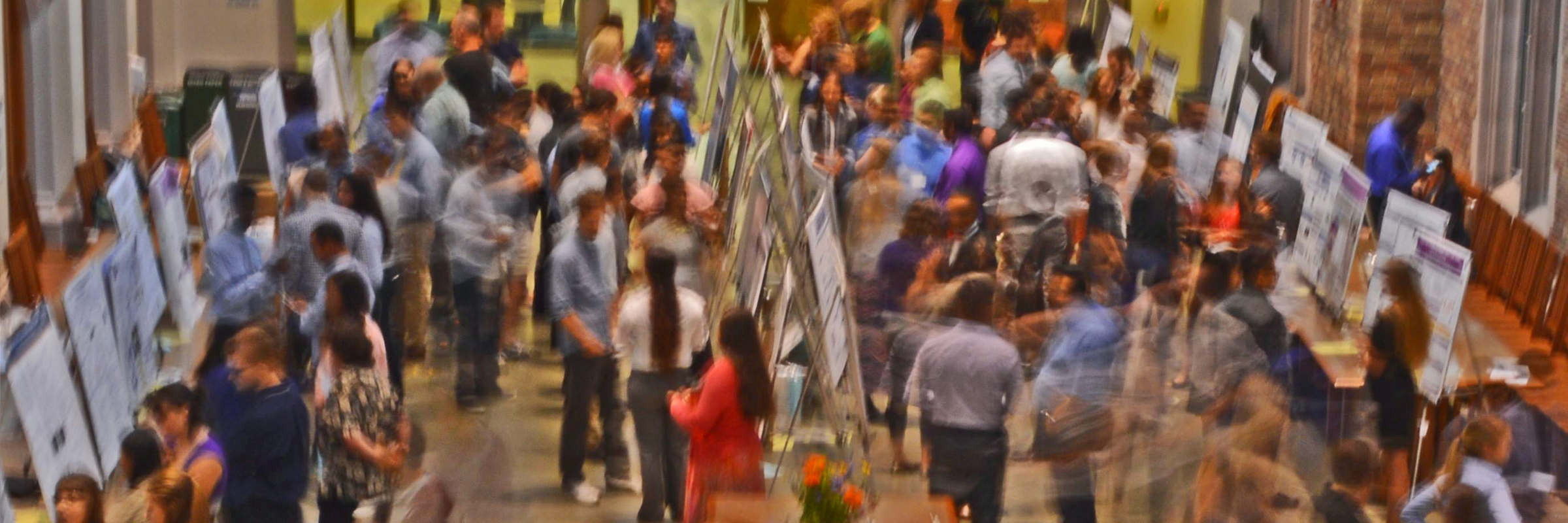 People at a scientific conference looking at posters.