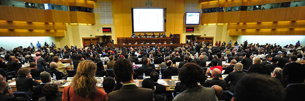 People at a conference listening to a talk.