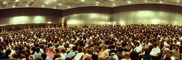 Many people seating at a conference.