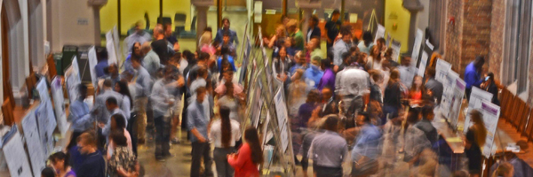 Abstract photo of people at a scientific meeting.